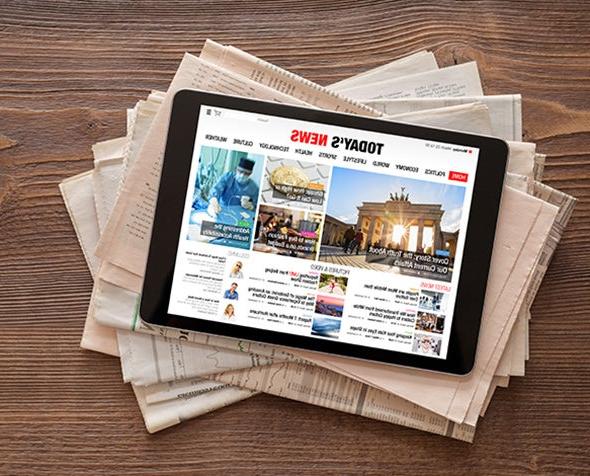 Newspapers and tablet